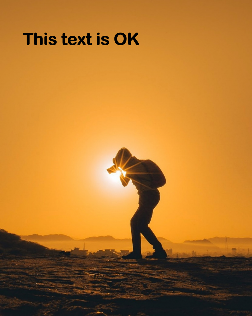 Photograph example with big uncluttered background space which is suitable to add text over. There is text 'This text is OK'.